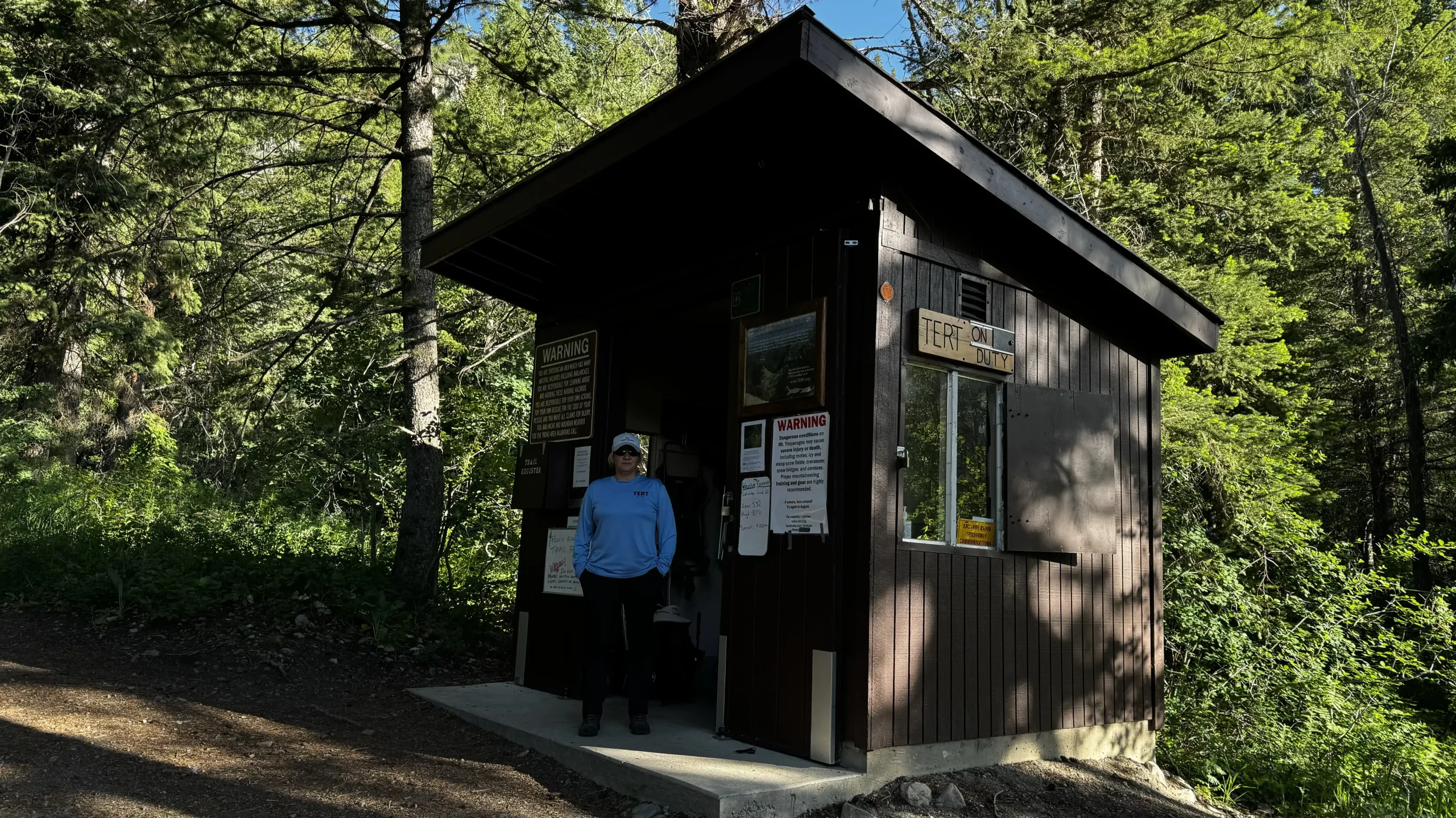A TERT member stands outside of the Aspen Grove shack